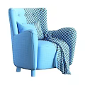 Yellow Armchair with Plaid Pillow and Gray Blanket on Wooden Legs