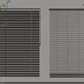 Dark Gray Blinds With Wide And Narrow Slats On Light Colored Wall With Green Plants