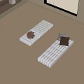 Beige Padded Floor Mats With Knitted Item And Cushions On Wooden Floor