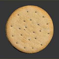 Stack of Golden Crackers with Small Holes on Surface on Dark Background