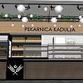 Sweet Shop Interior With Glass Display Counter Fresh Breads Wooden Decor And Green Plants