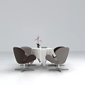 Stylish Leisure Chairs Around Round White Table With Pink Flowers And Book