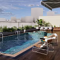 Modern Swimming Pool With Lounge Chairs Umbrella Plants And Wooden Deck