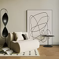 Single Beige Modern Sofa With Abstract Line Art Floor Lamp And Geometric Rug