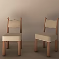 Two Kids Wooden Chairs with Beige Padded Seats Curved Backrests Simple Design for Children's Room
