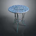 Round Blue Side Table With Intricate Carved Lace Design And Metal Legs