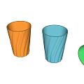 Colorful Plastic Cups With Wavy Texture One Tipped Over Red Orange Blue Green
