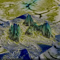 Dreamy Fantasy Landscape Featuring Jagged Mountain Peaks in Blue Green Tones and Winding Rivers