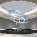 Modern Hotel Lobby with Spiral Art Installation Circular Ceiling Gray Walls and White Seating