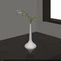 White Minimalist Vase Holding Green Leaves On Dark Wooden Table With Natural Light From Window