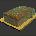 Delicious Vibrant Orange Bread Loaf on Yellow Tray with Colorful Sprinkles