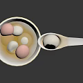 Traditional Chinese Tangyuan in White Bowl with Soup Pink White and Black Balls and Spoon
