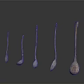 Metallic Spoons In Various Sizes And Shapes Arranged On White Background