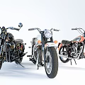 Three Classic Motorcycles With Black White Orange Bodies And Chrome Accents On White Background