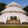 Spacious White Multi Layered Outdoor Tent With Transparent Roof Panels And Wooden Bar Counter