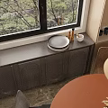 Modern Restaurant Interior With Dark Cabinet Round Tray Window Tree View And Round Table