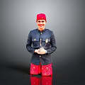 Man In Red Hat Dark Blue Jacket And Red Patterned Shorts Posing With Crossed Hands