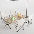 Outdoor Folding Table and Chair Set With Wooden Top White Seats Drinks And Green Boxes