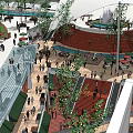 Vibrant Commercial Street Featuring Glass Canopy Lush Greenery Escalators Red Seating And Busy Shoppers