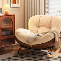 Beige Single Rocking Sofa With Soft Cushion Throw Blanket Near Wooden Cabinet Window And Plant