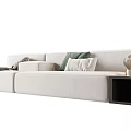 Modern Gray Sectional Sofa With Green White Cushions Gray Blanket Black Side Table Gold Lamp