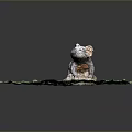 Koala Sculpture on Green Grass with Stone Base and Gray Orange Fur
