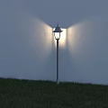 Outdoor Post Light Standing On Grassy Area Illuminating White Wall With Bright Beam