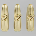 Three Gold Carved Decorative Ornaments With Intricate Patterns And Fine Craftsmanship