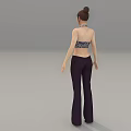 A Woman Wearing Floral Halter Top And Dark Flared Pants Against Gray Background