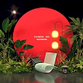 Chinese New Year Themed Photo Spot With Red Circular Installation Green Plants And White Chair