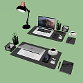 Organized Office Desk Setup With Black Desk Pads Laptops Phones Coffee Cups And Stationery