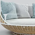 Round Wicker Outdoor Sofa With Light Blue And Gray Comfortable Cushions
