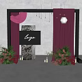 Elegant Floral Installation With Black Frame Purple Curtains And Logo Sign