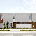 Modern Single Family Home With Gray Facade Windows And Wooden Fence Landscaping