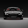 Sleek Black Sports Car With Red Seats And Illuminated Headlights Front View