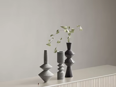 Minimalist Decorative Geometric Vases In Gray Black With Leafy Sprigs On White Countertop 3d model