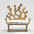 Abstract Shaped Sofa Featuring Wooden Structure Irregular Holes and Curved Design with Floral Cushion