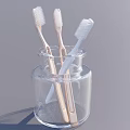 Clean Toothbrushes Stored in Transparent Glass Jar for Daily Use