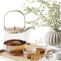 Glass Teapot and Small Teacups with Ceramic Vase and Flowering Branches on Wooden Tray