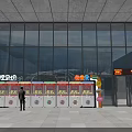 Colorful Outdoor Amusement Equipment With Multiple Claw Machines And Person Standing Near Building