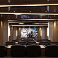 Elegant Modern Cinema Interior With Plush Seats Large Screen Movie Poster And Ambient Lighting