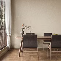 Wooden Dining Table Set with Gray Upholstered Chairs Vase Flowers Fruit Bowl and Natural Light