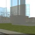 Modern School Building With White Orange Facade Large Windows And Green Lawn Area