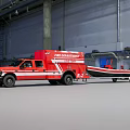 Red Fire Department Emergency Truck Towing Rescue Boat In Industrial Warehouse