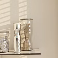 Glass Kitchen Containers with White Cubes Grains Spices on Light Shelf and Shade Light Shadows