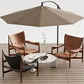 Outdoor Patio Table and Chair Set with Brown Black Chairs White Table Umbrella Vase Plant