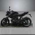 Black Motorcycle on Display Stand with Fallen Leaves Against Dark Background 3d model