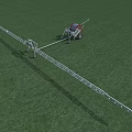Agricultural Sprayer With Extended Metal Arms Mounted On Trailer Operating On Green Grassland
