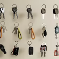 Variety of Keychains With Different Designs Including Car Keys House Keys and Colorful Straps