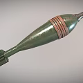 Green Cylindrical Military Weapon With Metal Body Copper Bands And Fins